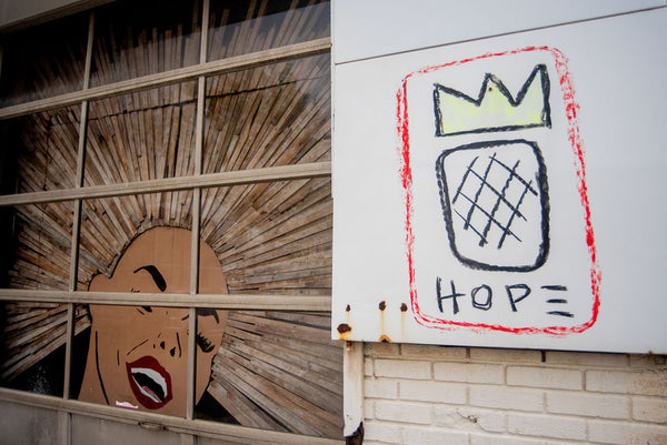 Street art showcasing a painting of a pineapple created by artist Philip Easton.
